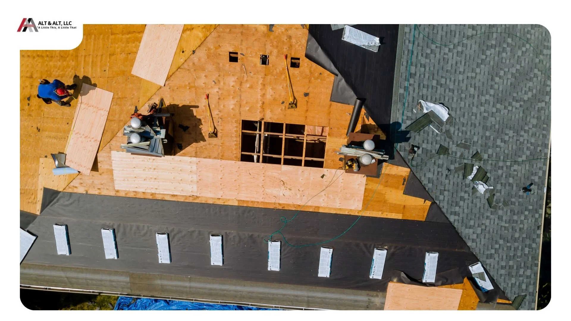 Roofing crew completing a tear-off on the first day of a roof replacement in Hudson, Ohio